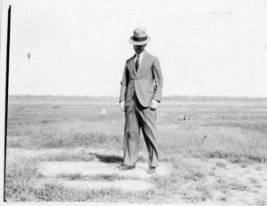 man standing in field