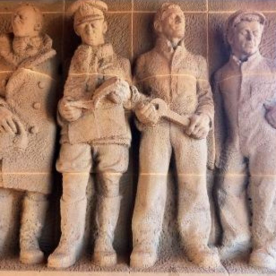 sculpture of four men
