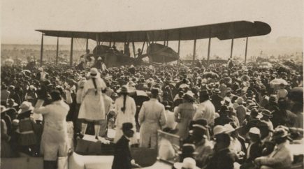 Crowd watching plane before take off 