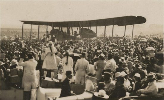Crowd watching plane before take off 