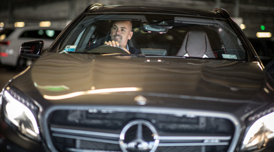 Man Driving A Car