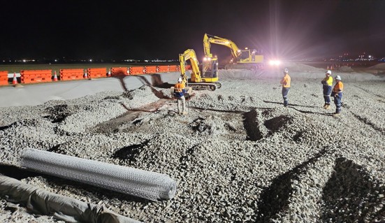 excavators digging upo airport runway