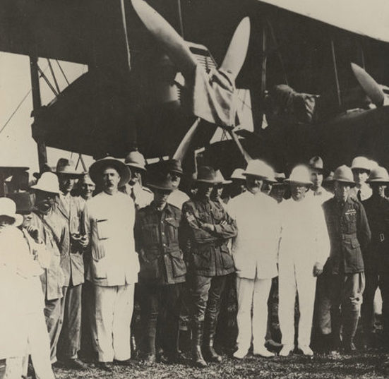 men standing infront of a plane