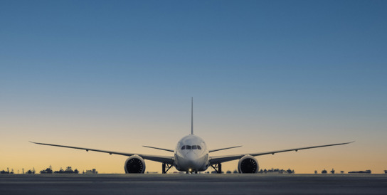 plane on tarmac at dusk