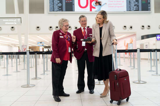 Two Ambassadors helping a customer 
