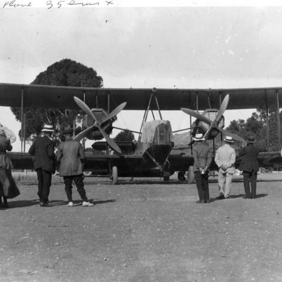 People standing looking at Vickers Vimy plane