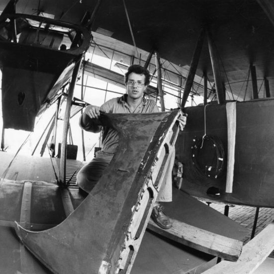 man working on building a plane