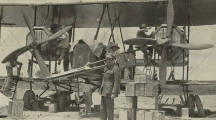 men loading up the vimy